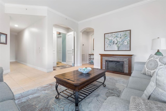 living room featuring light tile patterned floors and crown molding