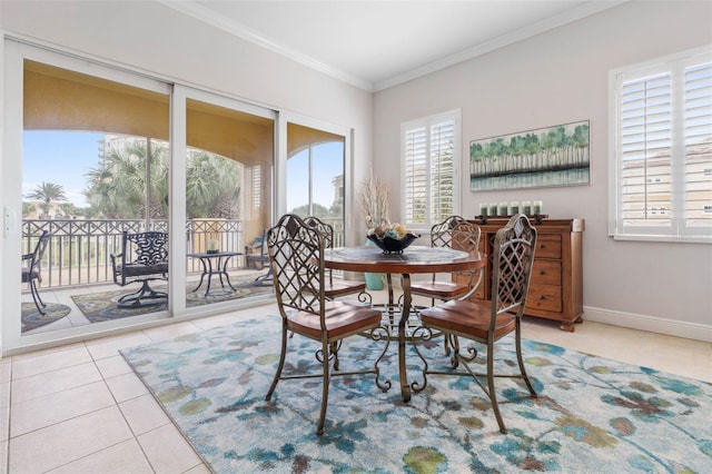 dining area featuring light tile patterned floors and ornamental molding