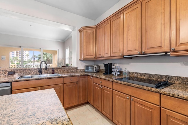 kitchen with dark stone countertops, black electric stovetop, sink, crown molding, and light tile patterned floors