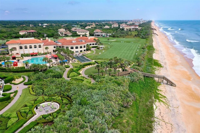 bird's eye view with a water view and a beach view