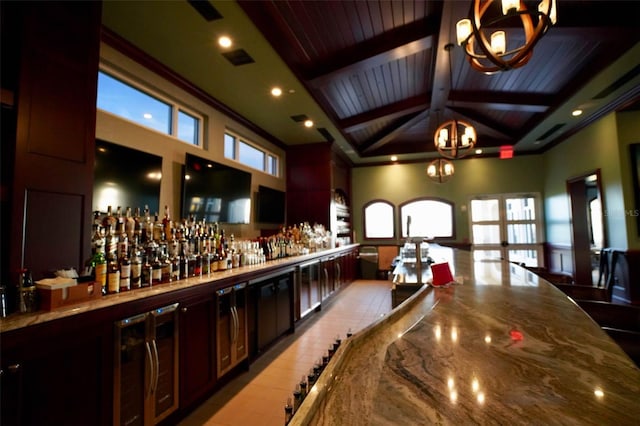 bar featuring high vaulted ceiling, beam ceiling, stone countertops, and pendant lighting