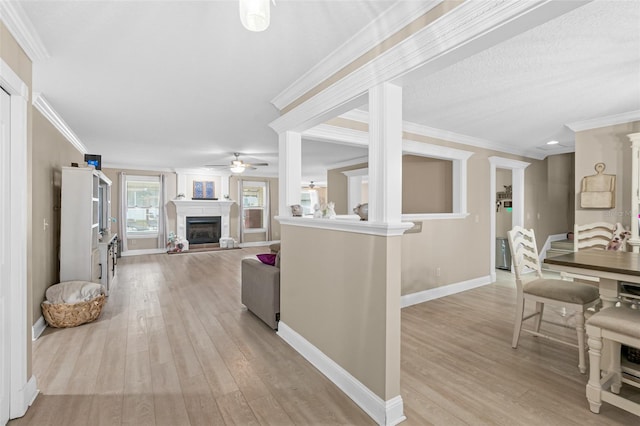 interior space featuring light wood-type flooring and ornamental molding