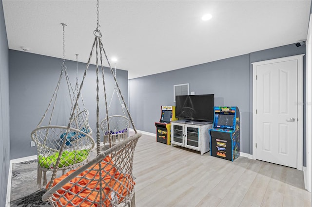 rec room featuring hardwood / wood-style flooring