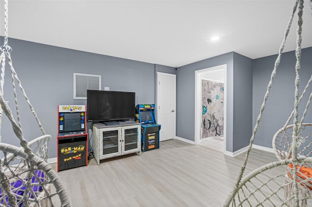 playroom featuring light wood-type flooring