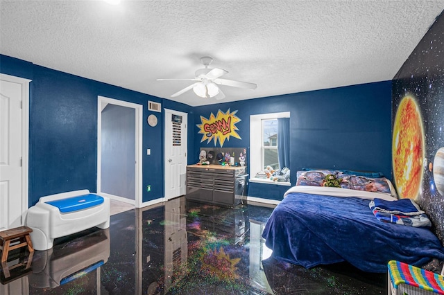 bedroom with ceiling fan and a textured ceiling