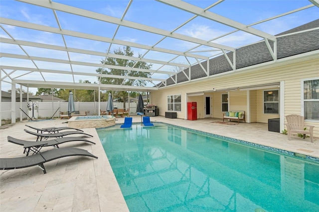 view of pool featuring a patio area, a lanai, and a jacuzzi