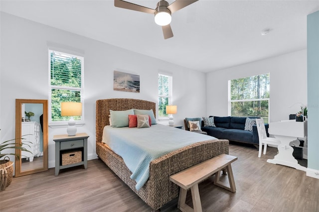 bedroom featuring ceiling fan and light hardwood / wood-style flooring