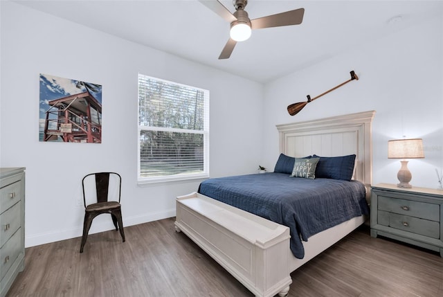 bedroom featuring hardwood / wood-style floors and ceiling fan