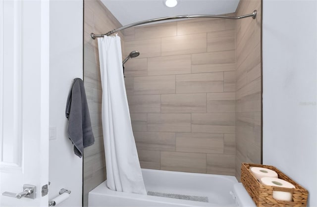 bathroom with shower / bathtub combination with curtain