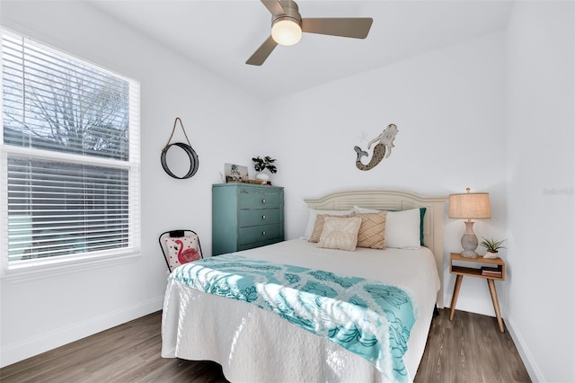 bedroom featuring dark hardwood / wood-style flooring and ceiling fan