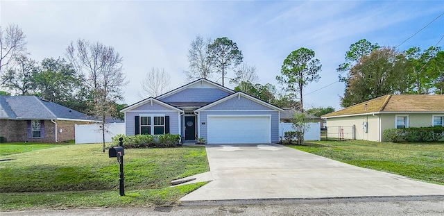 view of front facade featuring a garage and a front yard