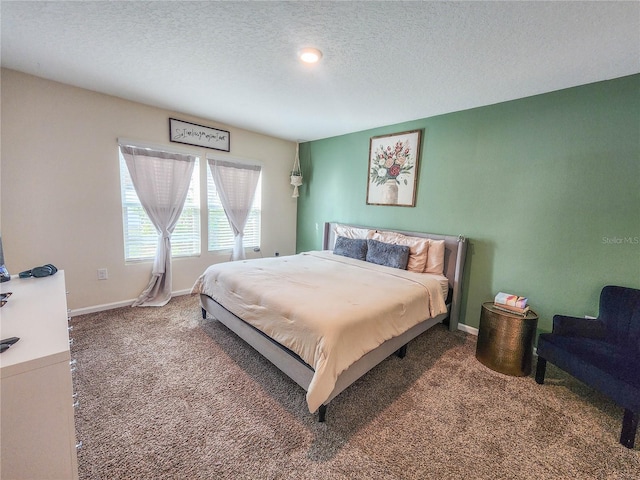 carpeted bedroom with a textured ceiling