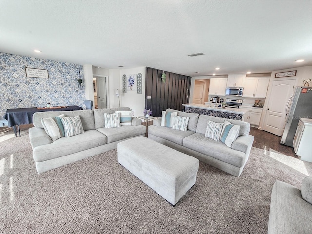 living room with a textured ceiling