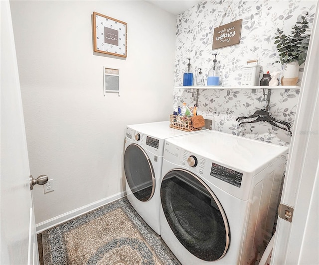 clothes washing area featuring washer and clothes dryer