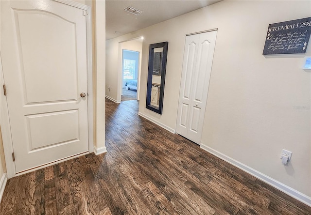 hall featuring dark wood-type flooring