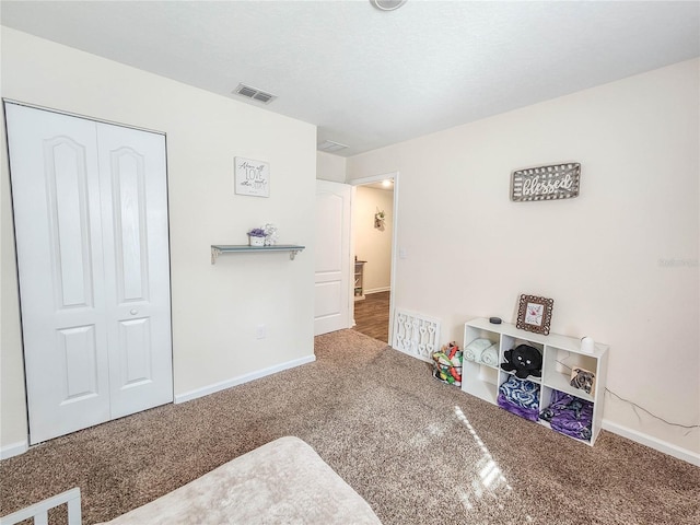 carpeted bedroom featuring a closet