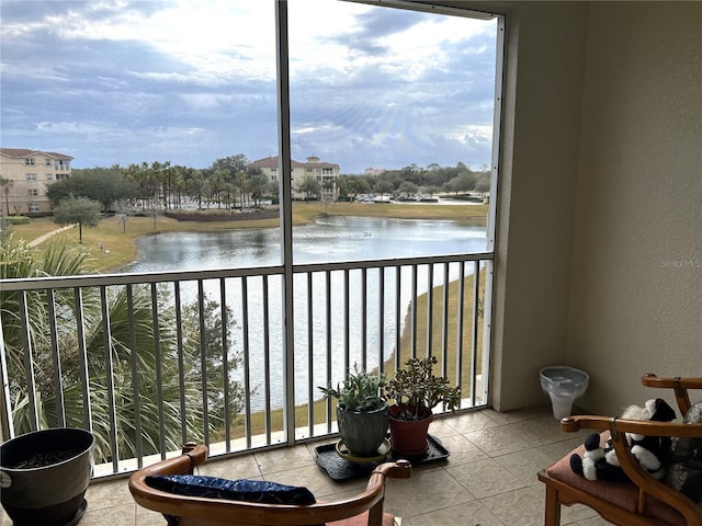 balcony featuring a water view