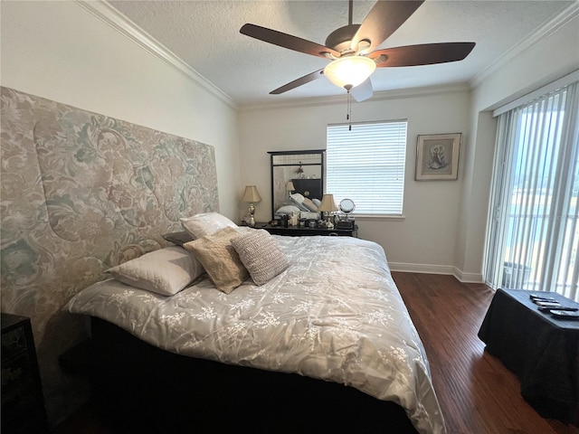 bedroom featuring crown molding, multiple windows, dark hardwood / wood-style flooring, and a textured ceiling