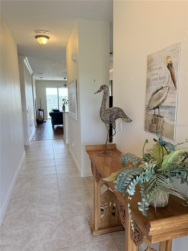 75 Riverview Bnd S Unit 1633, Palm Coast, FL 32137 - hallway with baseboards and light tile patterned floors