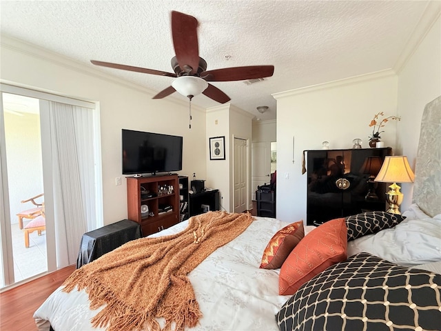 75 Riverview Bnd S Unit 1633, Palm Coast, FL 32137 - bedroom featuring wood finished floors, crown molding, a textured ceiling, ceiling fan, and access to outside
