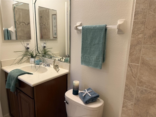 75 Riverview Bnd S Unit 1633, Palm Coast, FL 32137 - bathroom featuring vanity, toilet, and a textured wall