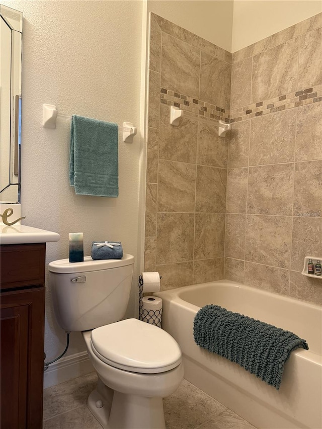 75 Riverview Bnd S Unit 1633, Palm Coast, FL 32137 - bathroom featuring toilet, vanity, bathtub / shower combination, tile patterned flooring, and baseboards