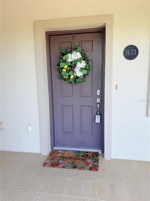 75 Riverview Bnd S Unit 1633, Palm Coast, FL 32137 - view of exterior entry with stucco siding