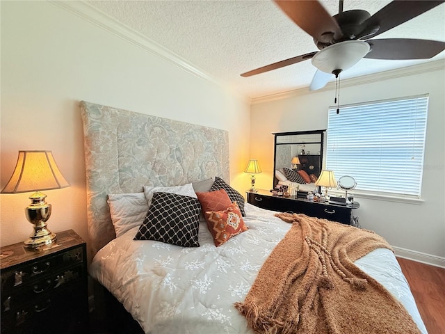 75 Riverview Bnd S Unit 1633, Palm Coast, FL 32137 - bedroom with wood finished floors, ornamental molding, a ceiling fan, a textured ceiling, and baseboards