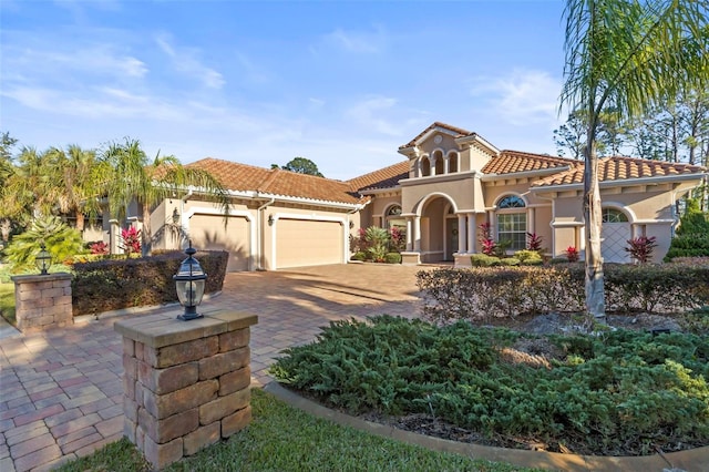 mediterranean / spanish-style home featuring a garage