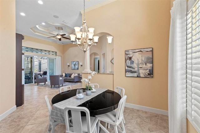 dining room with light tile patterned flooring, ornamental molding, ceiling fan with notable chandelier, and coffered ceiling