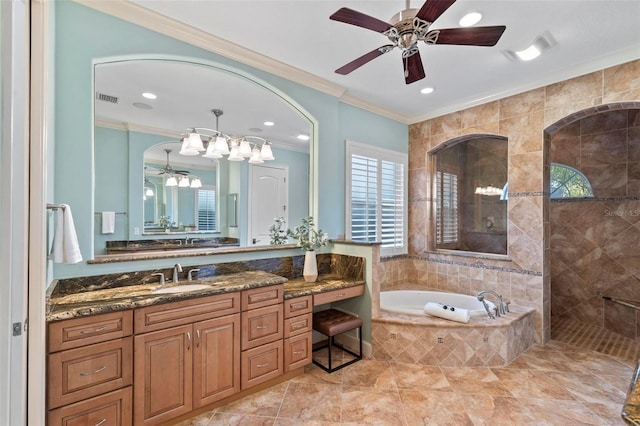 bathroom featuring ceiling fan, vanity, ornamental molding, and plus walk in shower