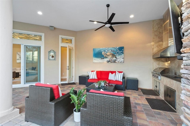 living room featuring ceiling fan and french doors