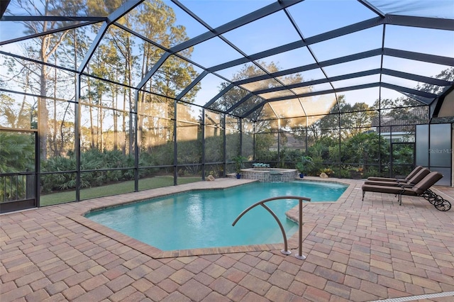 view of pool with an in ground hot tub, a lanai, and a patio area