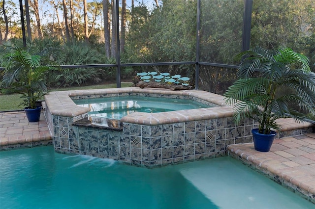 view of swimming pool featuring an in ground hot tub