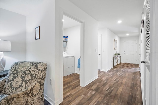 hallway featuring dark wood-type flooring and washer / dryer