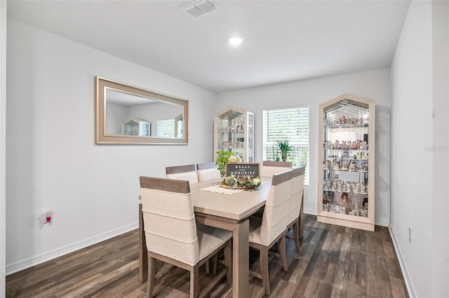 dining room with dark hardwood / wood-style floors