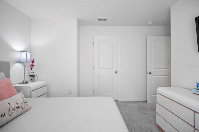 bedroom featuring light carpet