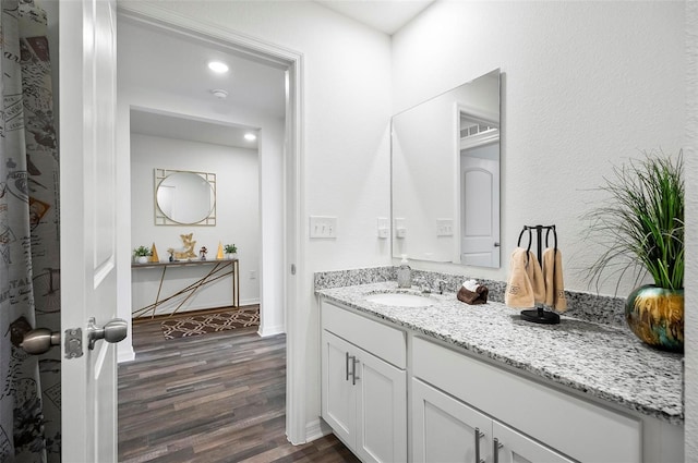 bathroom with wood-type flooring and vanity