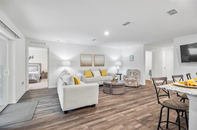 living room with dark hardwood / wood-style floors