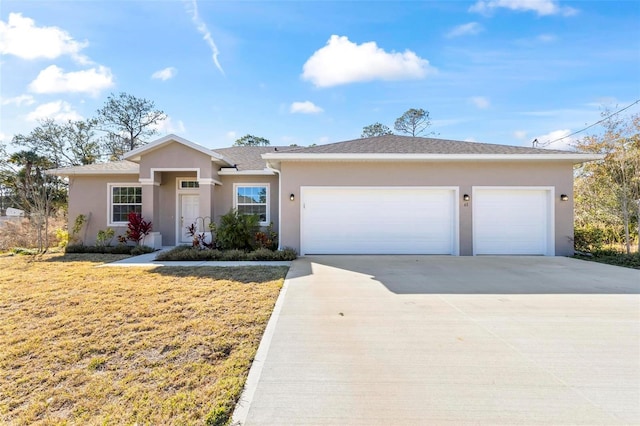 ranch-style home featuring a garage and a front yard