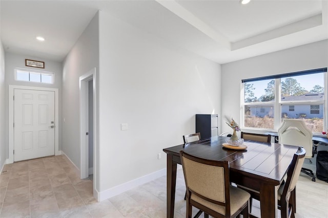 dining room featuring a tray ceiling