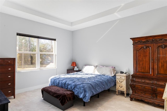 bedroom with a raised ceiling