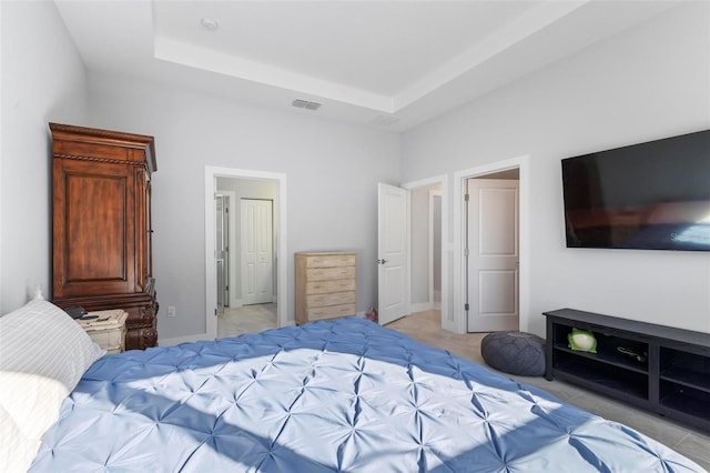 bedroom with a tray ceiling