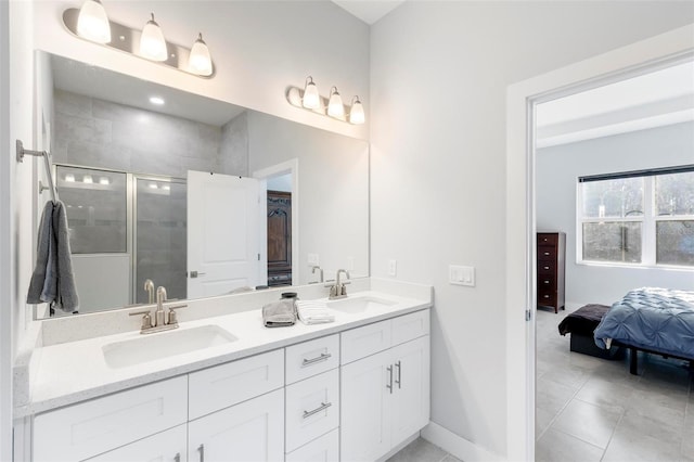 bathroom featuring tile patterned floors, vanity, and a shower with shower door