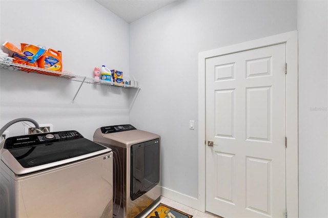 laundry area featuring washing machine and clothes dryer