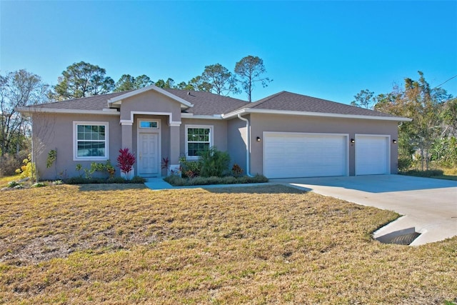 ranch-style house featuring a garage and a front lawn