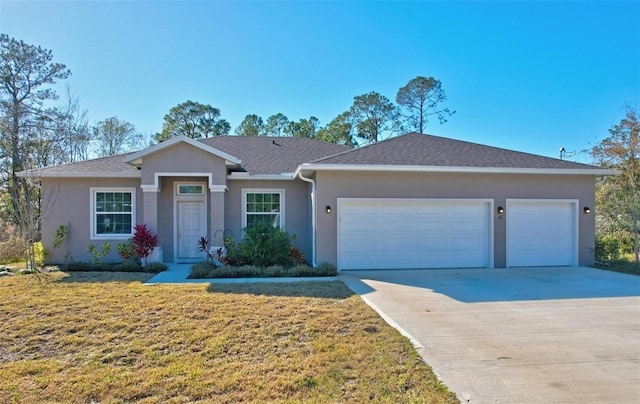 ranch-style house with a garage and a front lawn