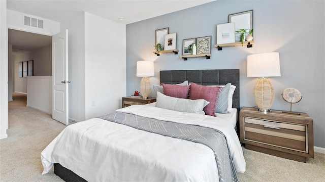 bedroom featuring light colored carpet