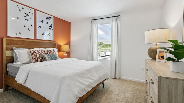 bedroom featuring light colored carpet