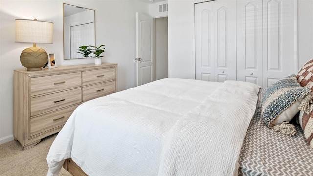 carpeted bedroom featuring a closet